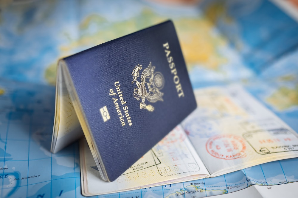 a passport open sideways on top of another passport