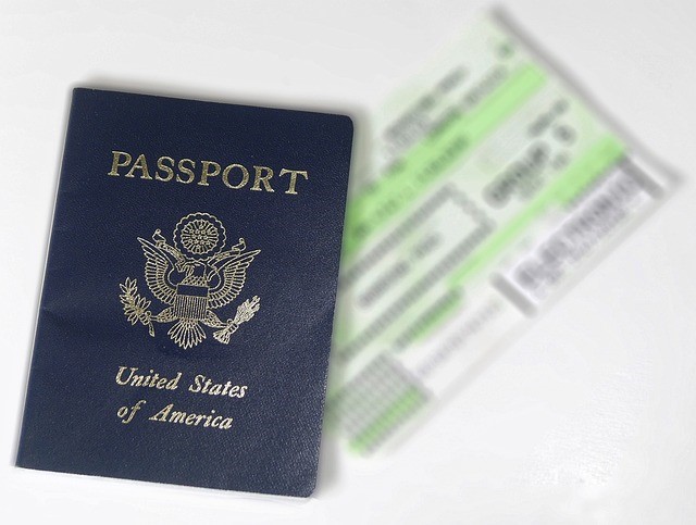 a passport next to a ticket