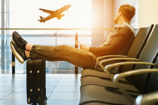 A person sitting at an airport