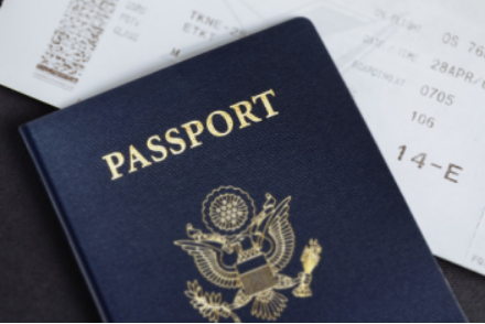 a ticket and a passport on a table