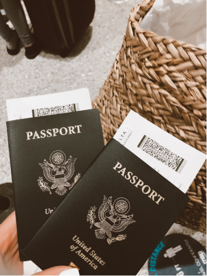 A photo showing a person holding two passports.