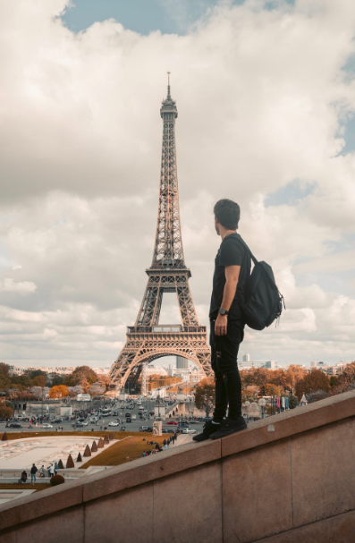 A person looking at the Eiffel Tower.