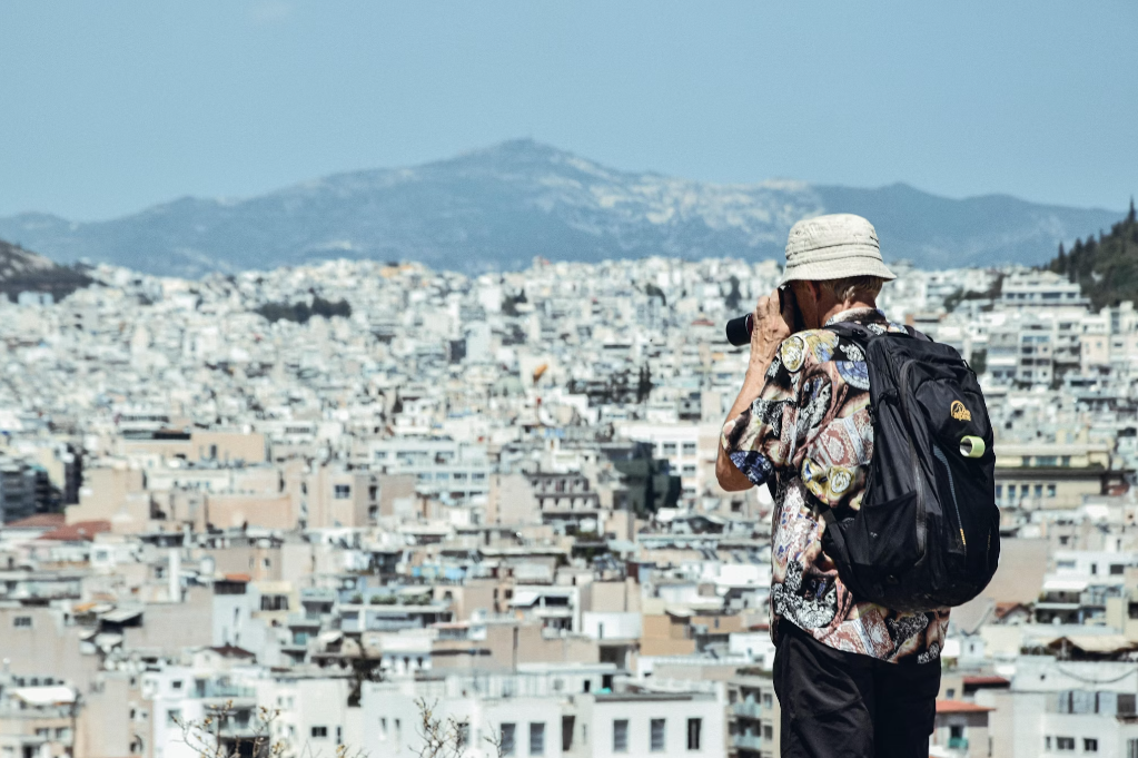 A traveler capturing photos using a professional camera. 