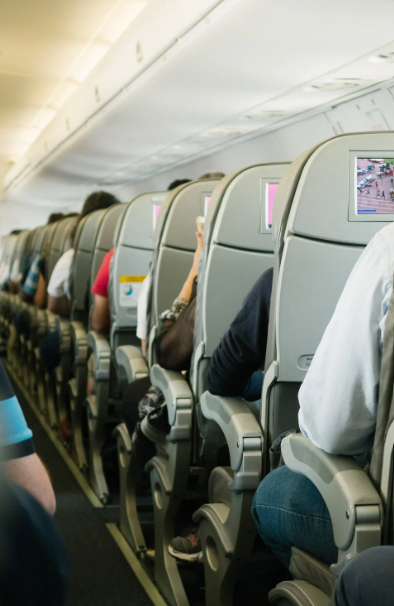 Passengers seated in an airplane.