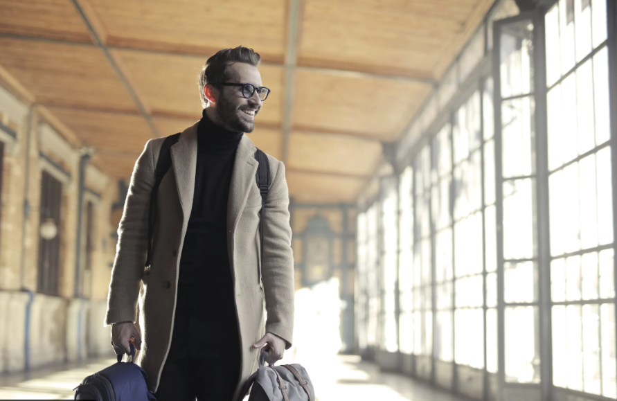  A business traveler carrying two bags. 