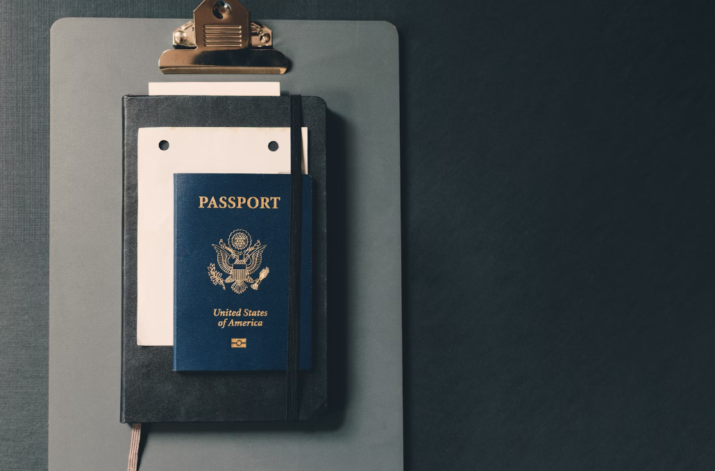 A passport on a notebook.