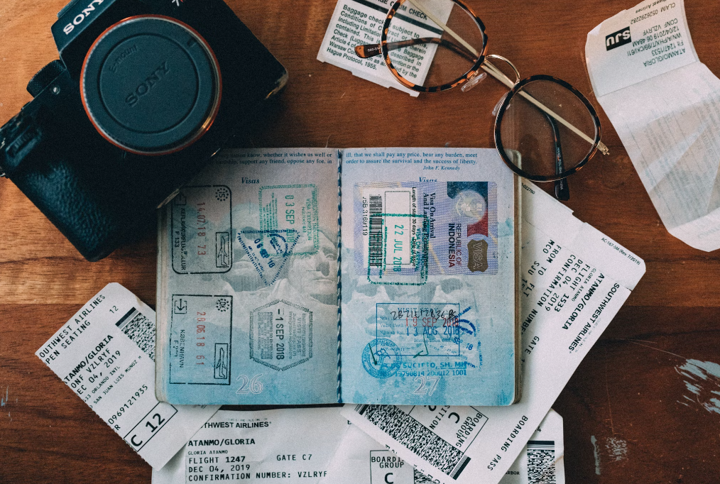 An open passport with stamps. 