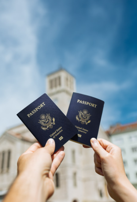 Two tourists holding their passports.