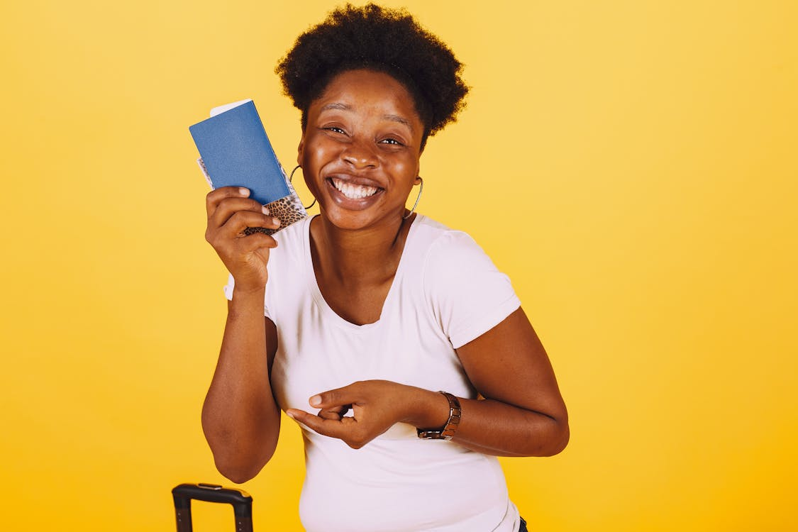 A happy traveler with their expedited passport in hand