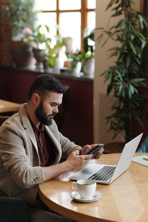 A person checking their passport application status on a phone