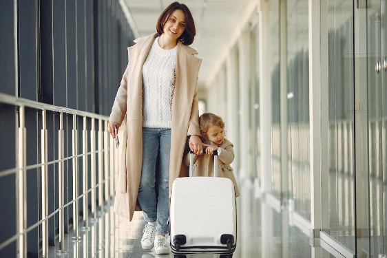 A mom and son waiting at the airport