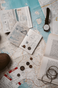scattered travel documents and coins on a passport